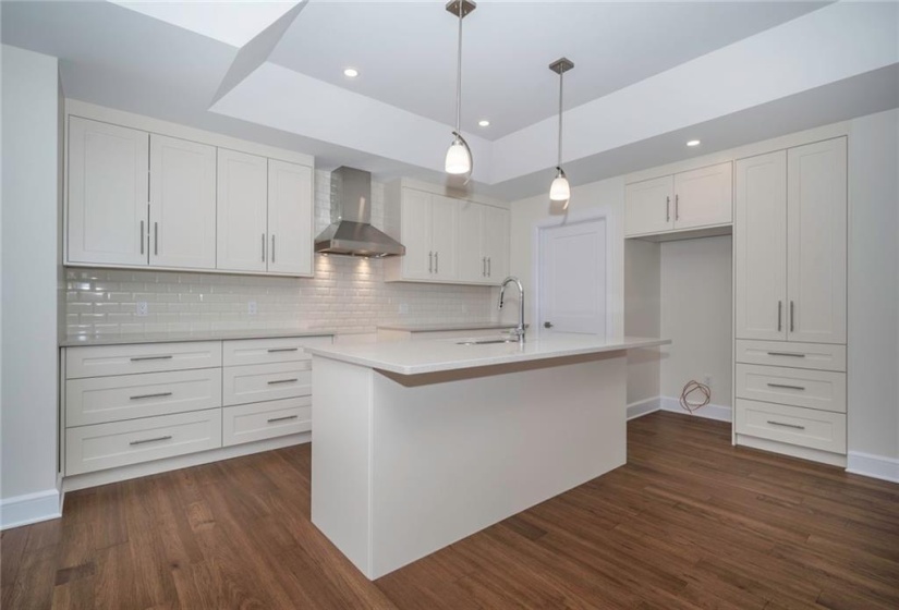 Beautifully finished kitchen with stone counters