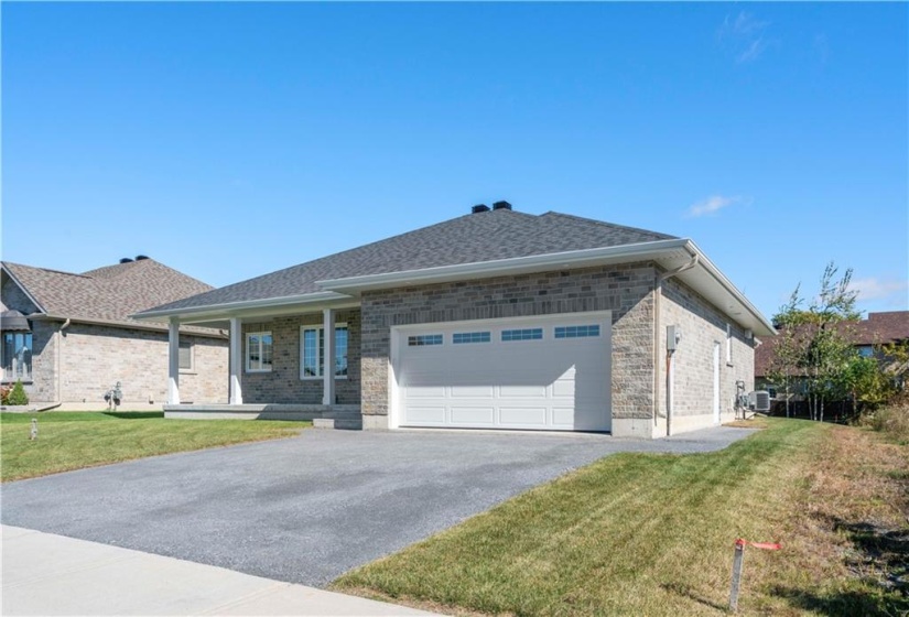 1760 S.Ft. Brand New Custom built by Chester Leclerc Ltd two bedroom brick bungalow with double garage and beautifully  finished in the Riverdale family neighbourhood