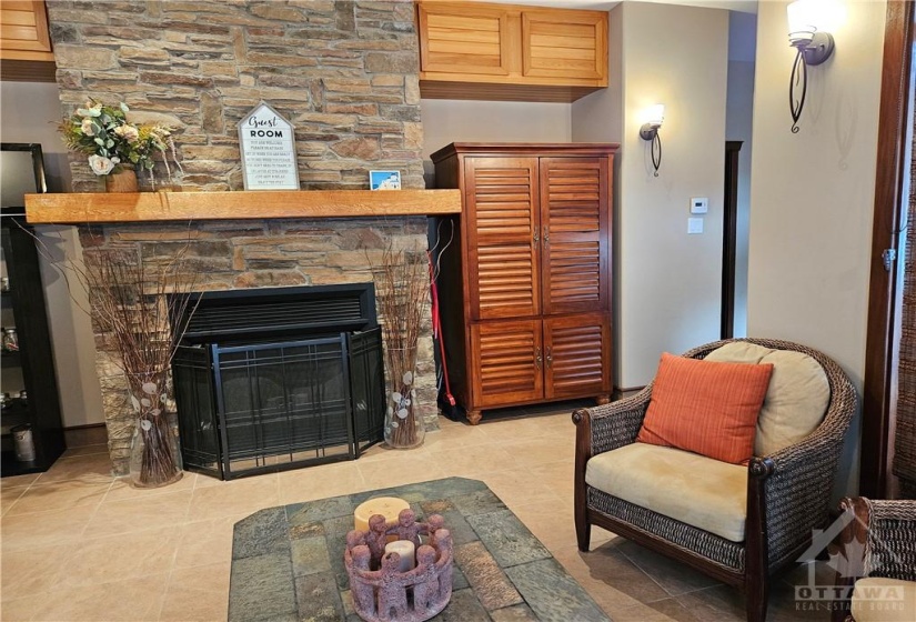 This is the main living area in the guest house with easy clean ceramic tile floors. The fireplace is for wood burning. The house is heated with a forced air gas furnace, there is a storage area with custom cabinets.