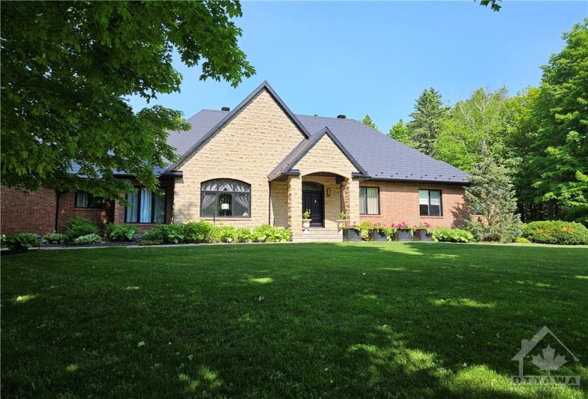 This home includes 6,904 sq. feet of living space on two levels of the main home. Stone and brick envelop this home. The walkways are covered with custom stone tile. The Wakefield Bridge Steel Shingles installed on the main house, guest house and gazebo in 2018 means not having to worry about changing shingles or snow accumulation on the roof. Comes with a transferable 50 year warranty