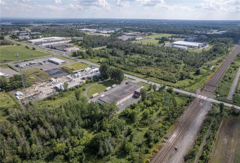 Aerial view from the north east overlooking the northeast overlooking the building and dock level loading area on the north of the building and looking towards the City of Cornwall Industrial Park Development south of Marleau Ave.