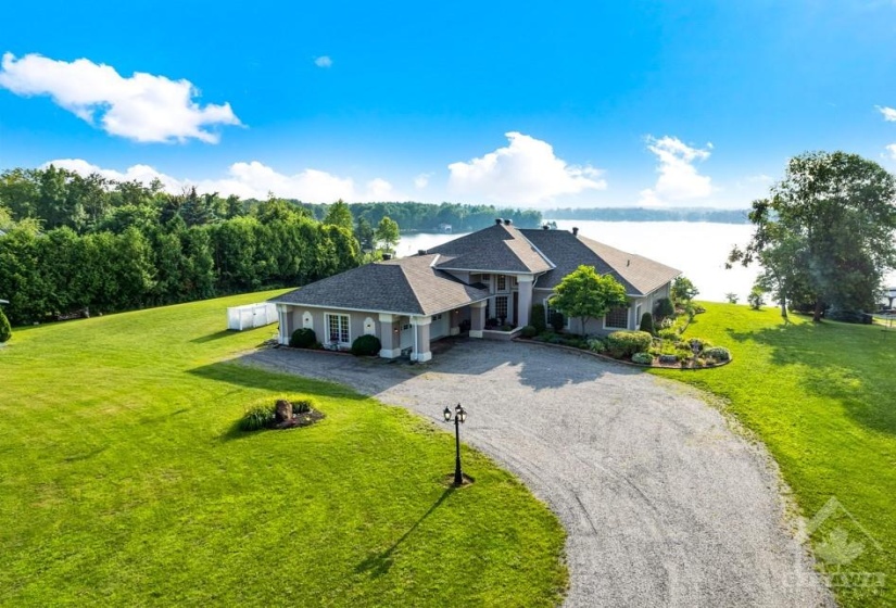 Facing west for sunset views, luxurious bungalow with 2 acres on Big Rideau Lake