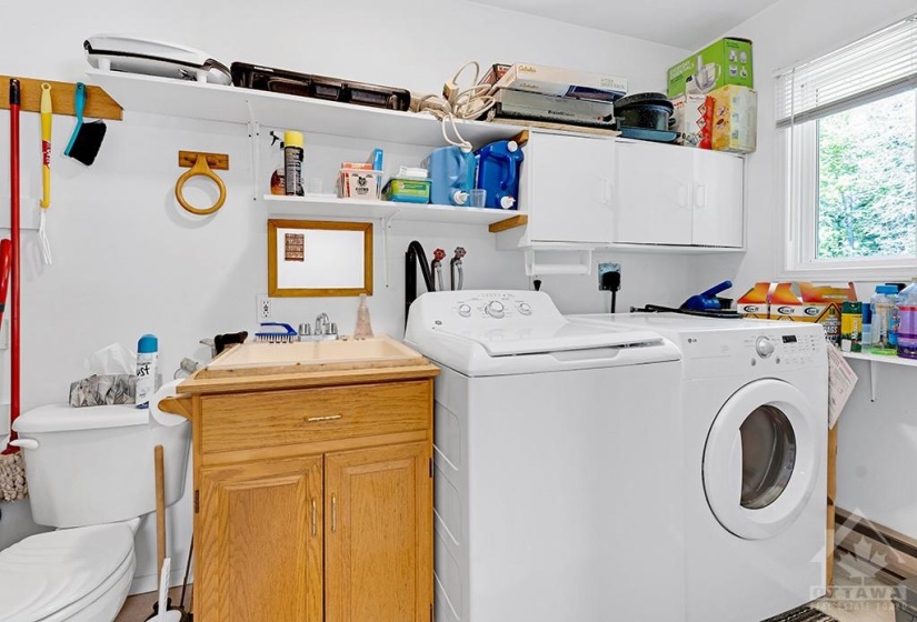 Combined laundry room and half-bathroom