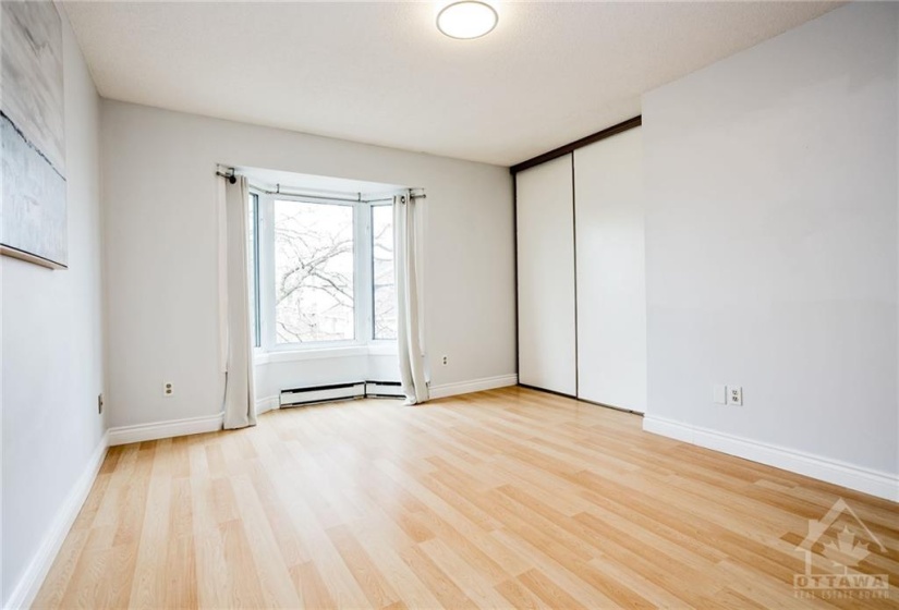 Primary Bedroom Features DOUBLE Closets & Large Window letting in Tons of Natural Light