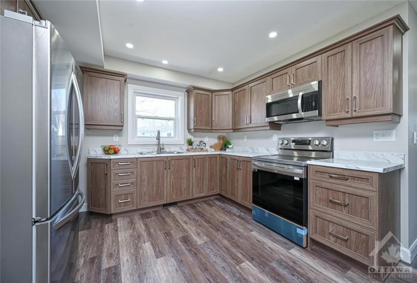 beautiful kitchen with ample cabinets, drawers and wonderful  counter space.