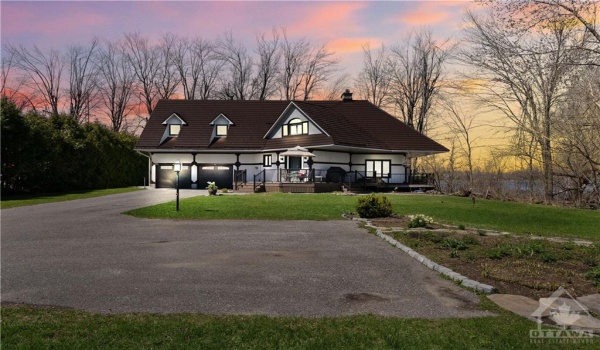 Welcome to 3756 Mapleshore Drive.  Your waterfront oasis awaits you with double car garage.