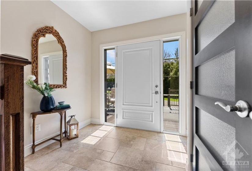 Enter the home through this gorgeous welcoming foyer with beautiful natural light beaming in.