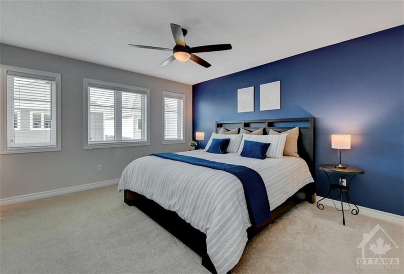 Primary bedroom can easily fit a king-size bed and has massive walk-in closet.
