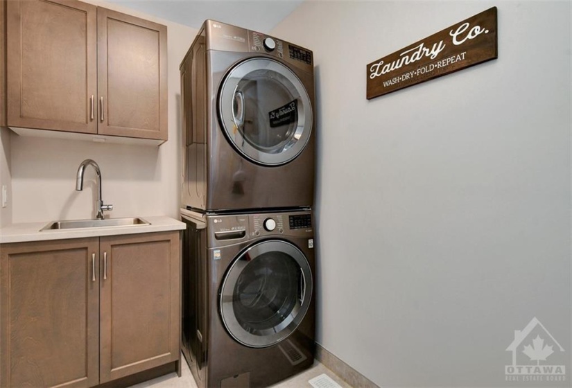 Deluxe laundry room is conveniently located on the second floor where all your laundry is.
