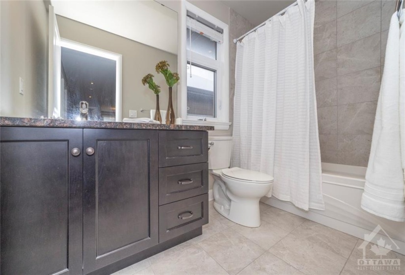 Main bathroom on second level provides all the space a large family needs.