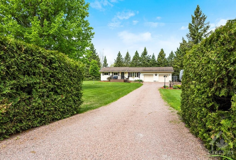 Attractive well-maintained bungalow, with 200 acres of Crown Land directly across road and another 630 acres to left and right,  just steps away