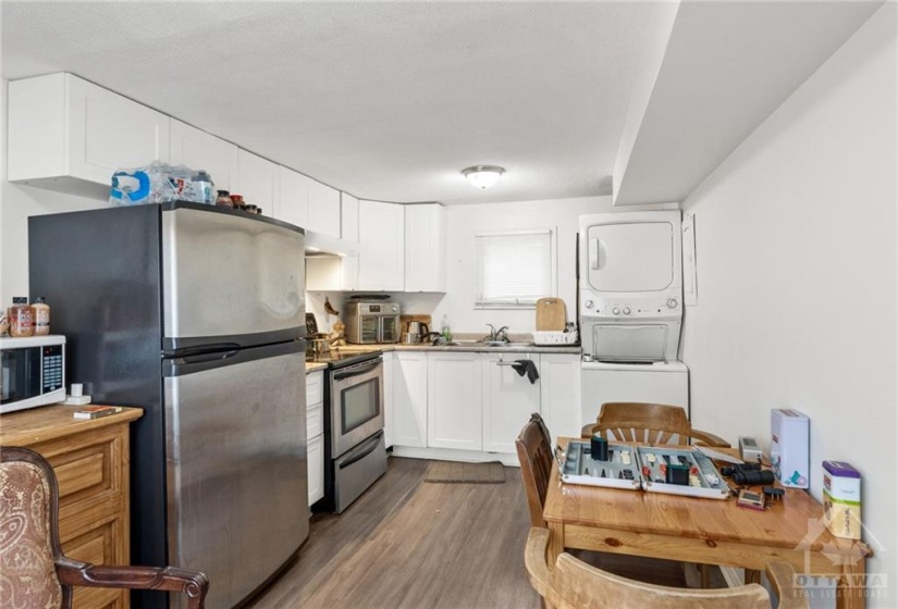 Apt 3 (Located at back of House) - Updated Eat-in Kitchen, Vinyl Floors & appliances.