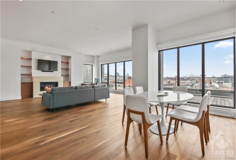 No lack of entertainment space for a large party...note the beautiful wide plank walnut floors.