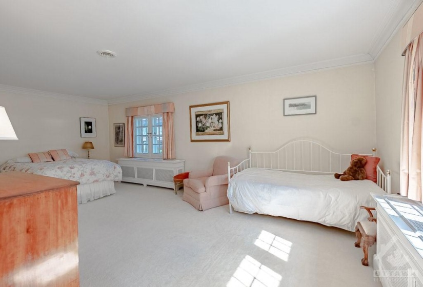 Second bedroom with ensuite and walk-in closet.