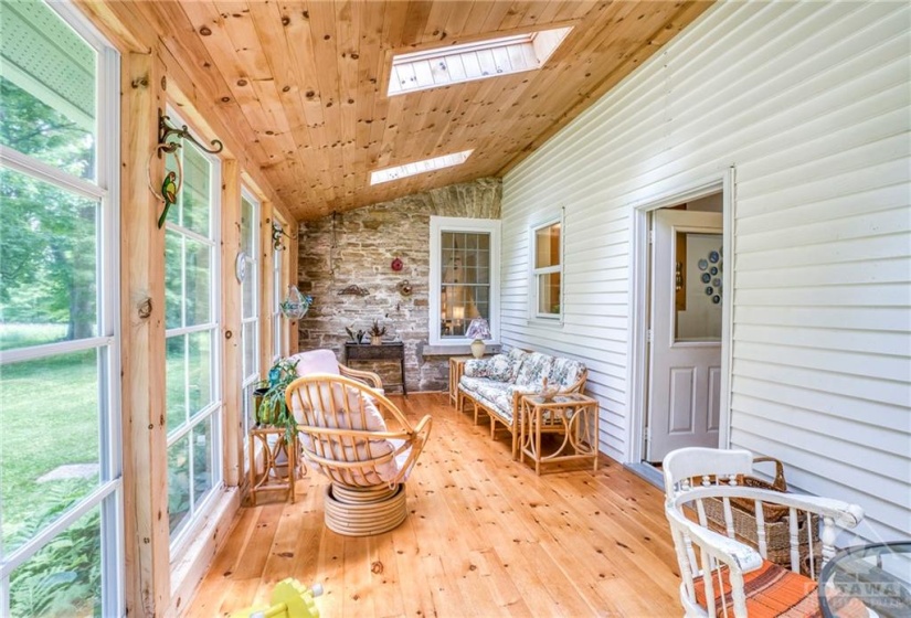 Sunroom with ceiling high windows