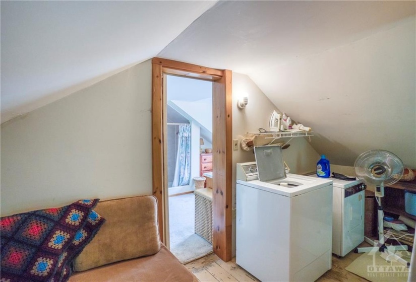 Laundry/storage room With back staircase