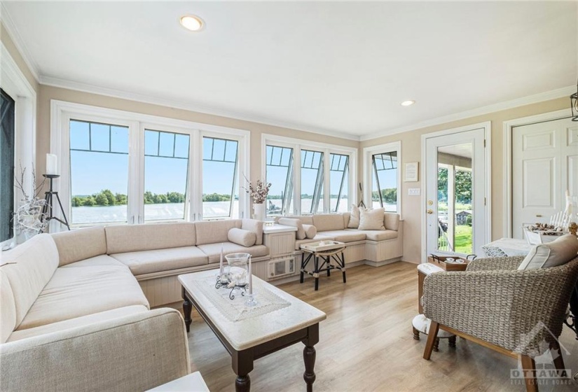 Main floor family room with bar and amazing river view.