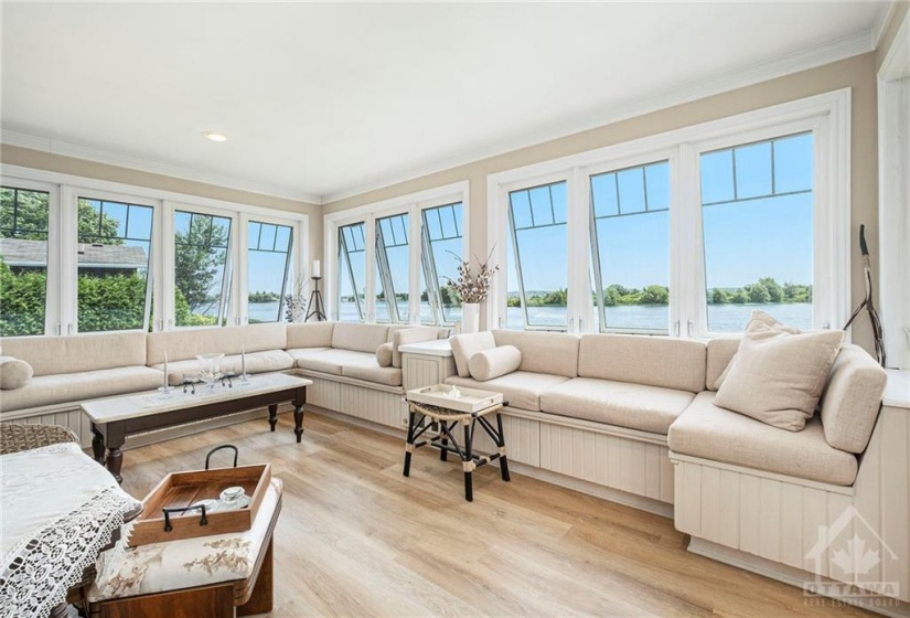 Main floor family room with bar and amazing river view.