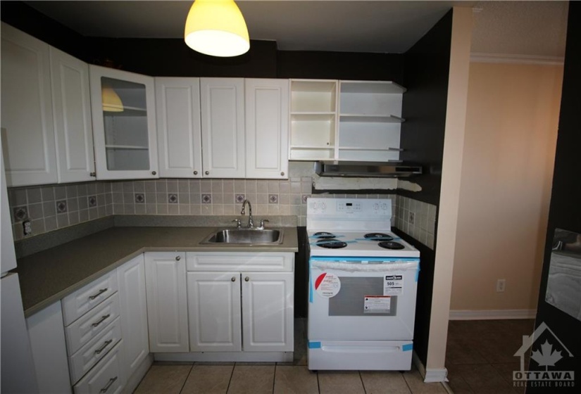 Kitchen w/ Newer Stove and abundant cabinetry