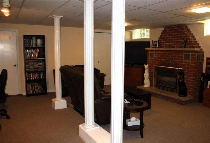 Basement rec room with gas fireplace