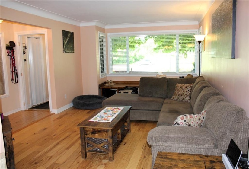 Large bright Living room opens to dining area and kitchen