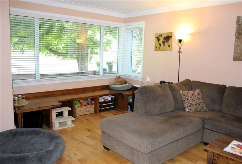 Living room built in bench and hardwood floors