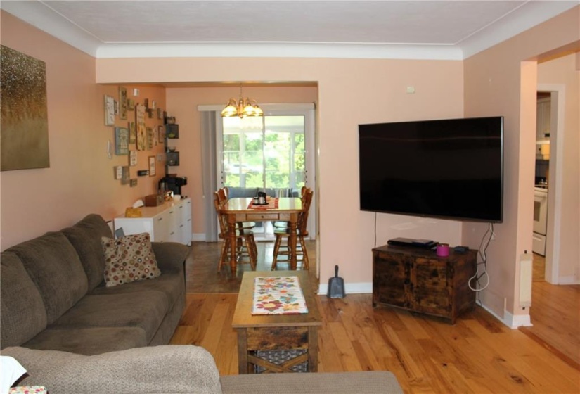 Living to dining area and patio doors to sunroom