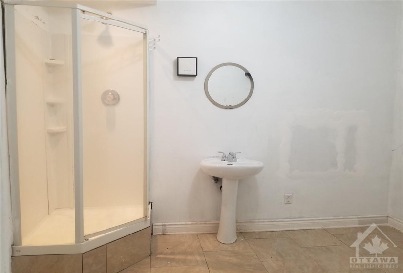 Stand-Up Shower & Pedestal Sink in large, private sealed room