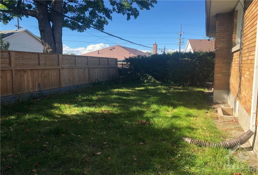 fenced backyard with a shed