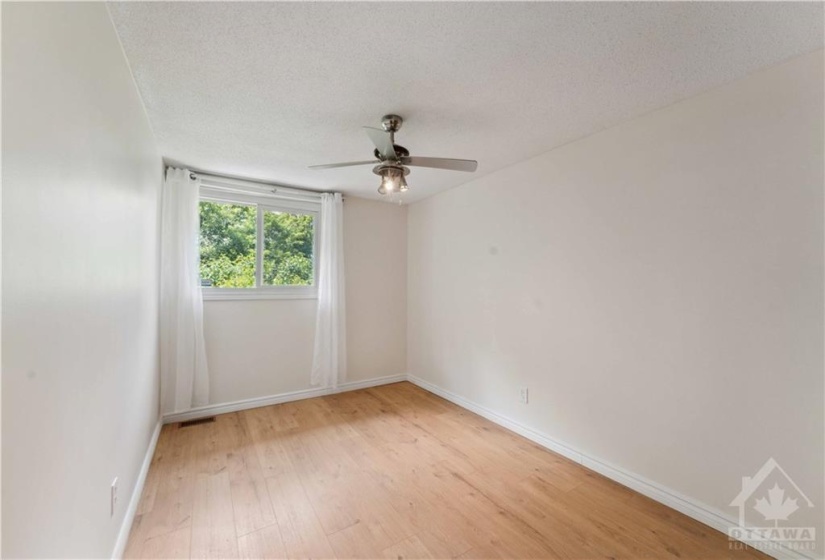 bedroom 3 with laminate flooring