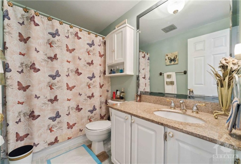 Updated vanity with granite top also Ceramic floors