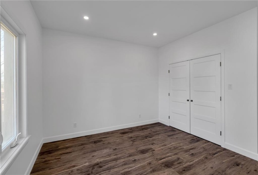 Primary bedroom showing double closet.