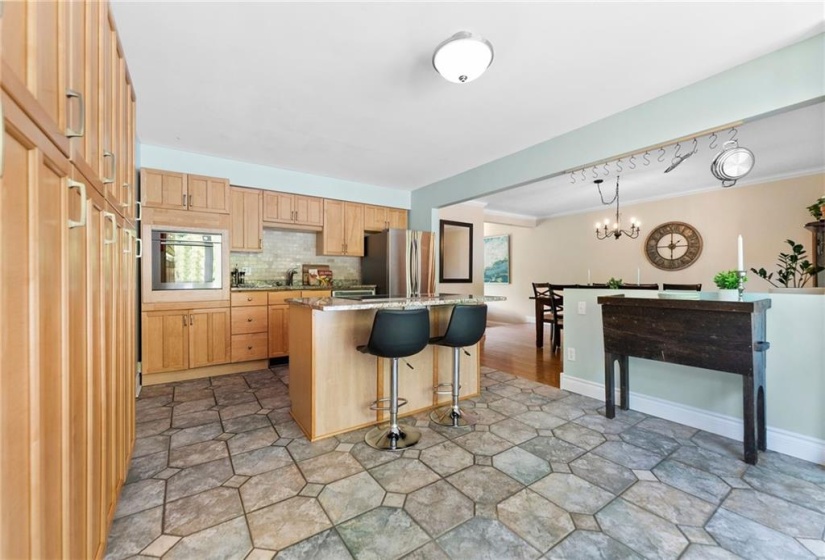 Maple cabinets and granite countertops in your eat-in kitchen.