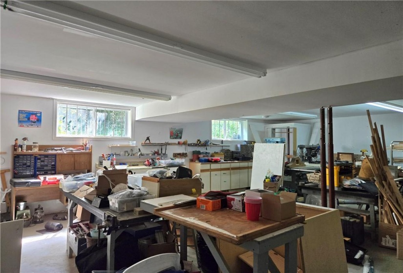 750 sq ft workshop under in-law suite. Could be converted to additional apartment.