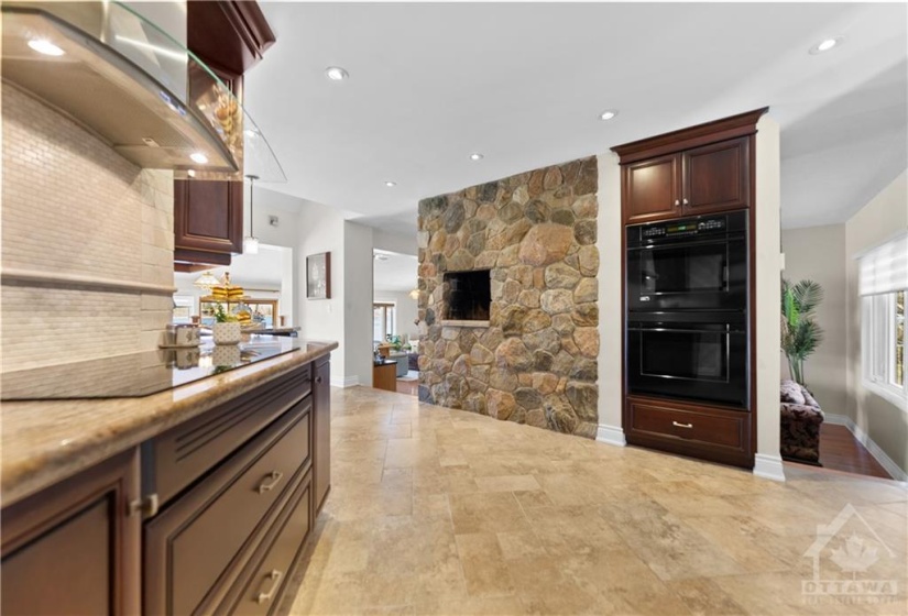 Gorgeous stone wall (back of fireplace in the living room).  Double ovens and storage and the opening in the wall is a pizza oven.  My client puts her George Foreman grill in there.