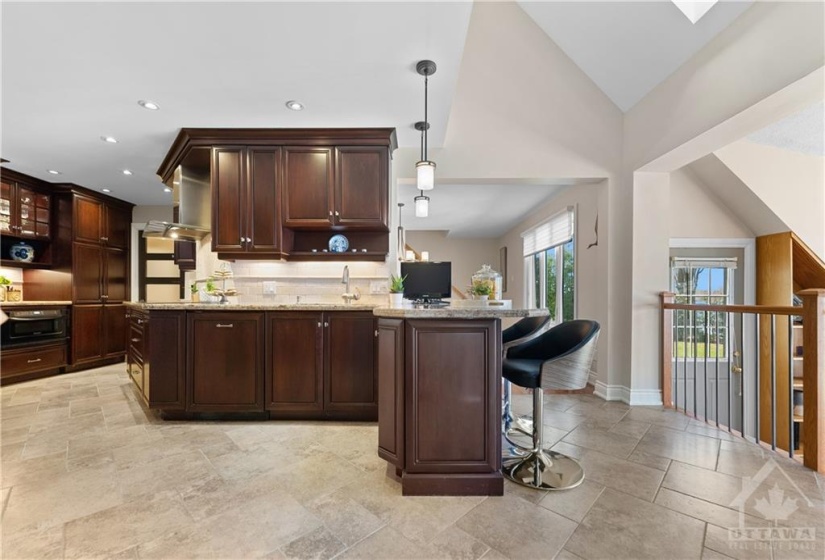 This kitchen is absolutely beautiful with solid cherrywood cabinets, induction cooktop, microwave drawer and paneled appliances.  There are no carpets in this home.