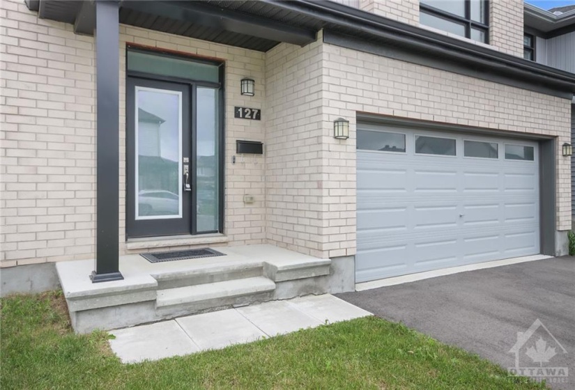 Covered front entrance and double garage