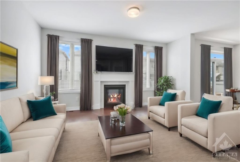 Staged family room with gas fireplace