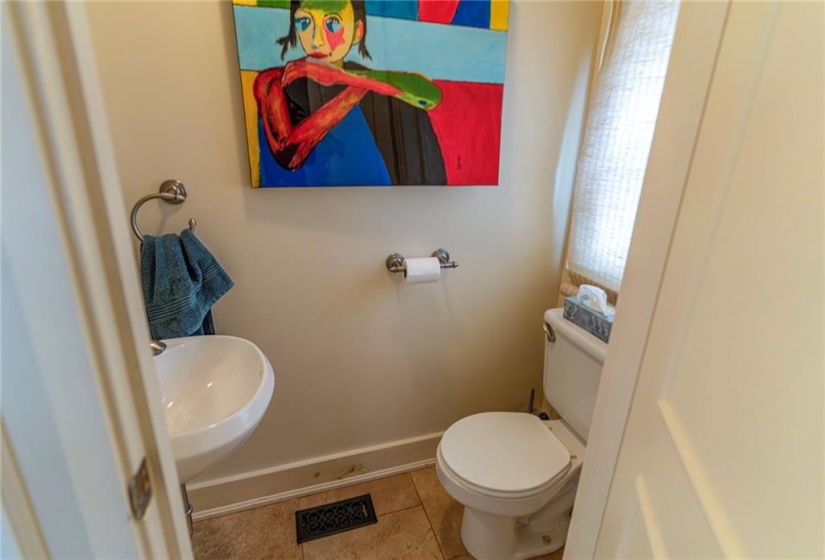 Main floor powder room directly off the laundry room