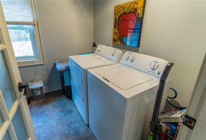 Main floor laundry room with attached powder room