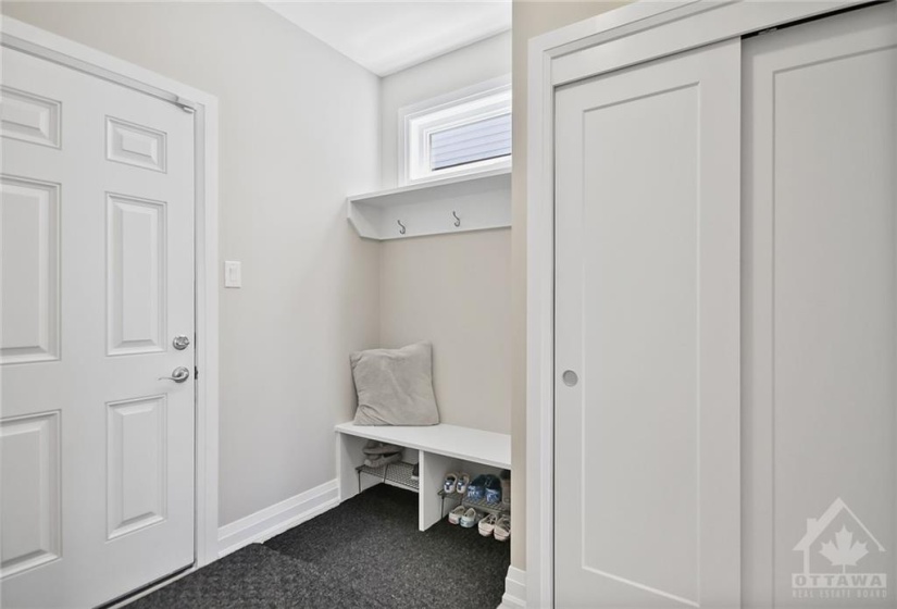 Mudroom with entry from garage and into the kitchen