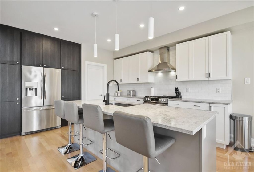 Custom millwork with pullout drawers and undercabinet lighting