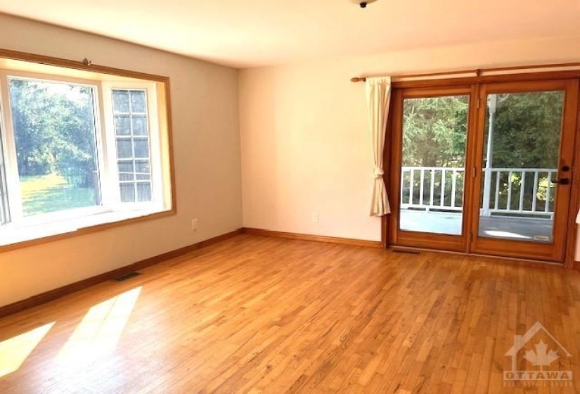 Family room with lots of natural light and access to large deck