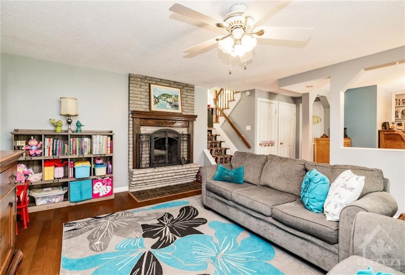 Cozy fireplace in this lower level walkout family room