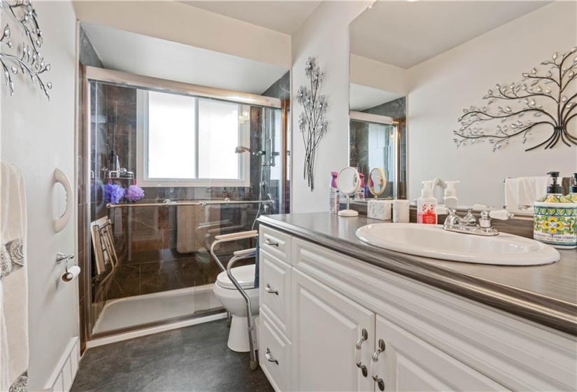 Modern/upated 3pc bath with walk-in shower on the main floor.