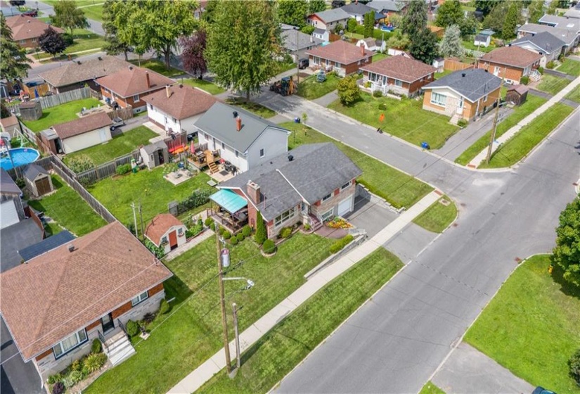 Aerial view of the side yard and covered patio.