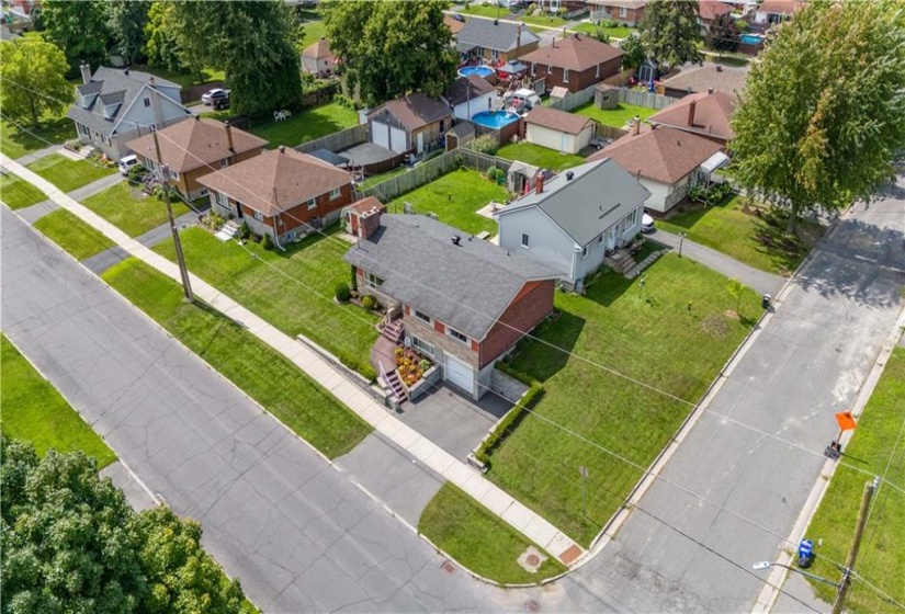 Additional aerial view of the home and lot.