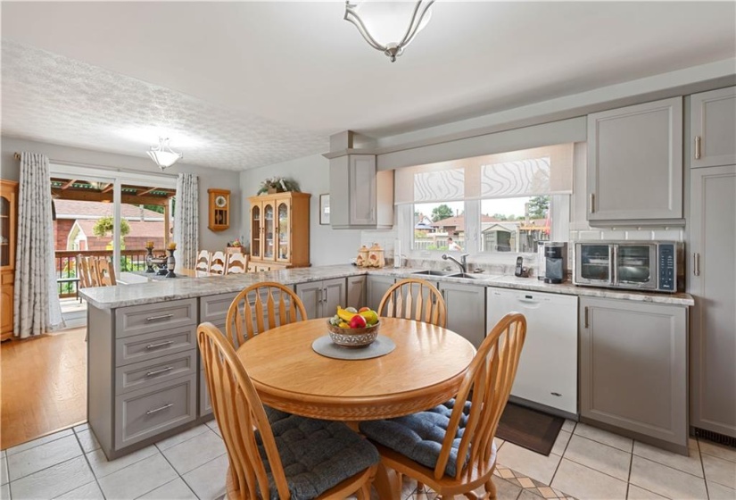 Modern/contemporary kitchen finish with easy to maintain ceramic tile flooring.