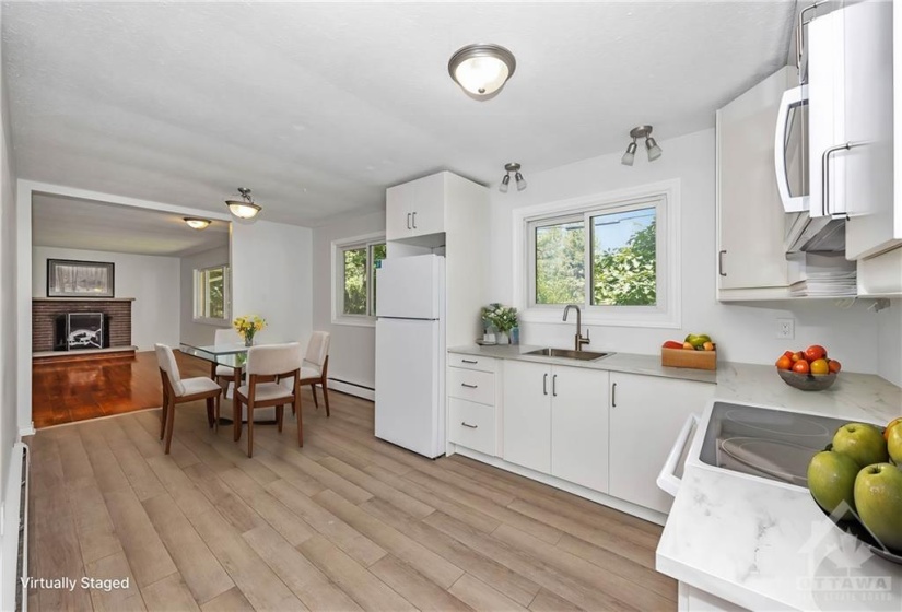 Kitchen and eating area (virtually staged)