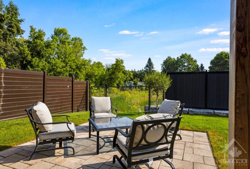 Enjoy afternoons on the patio, overlooking green space.